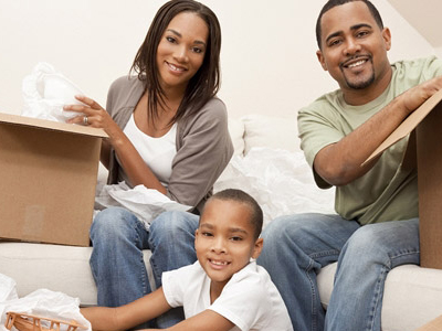 family unpacking after moving in