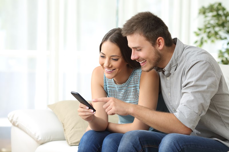 young couple researching auto insurance