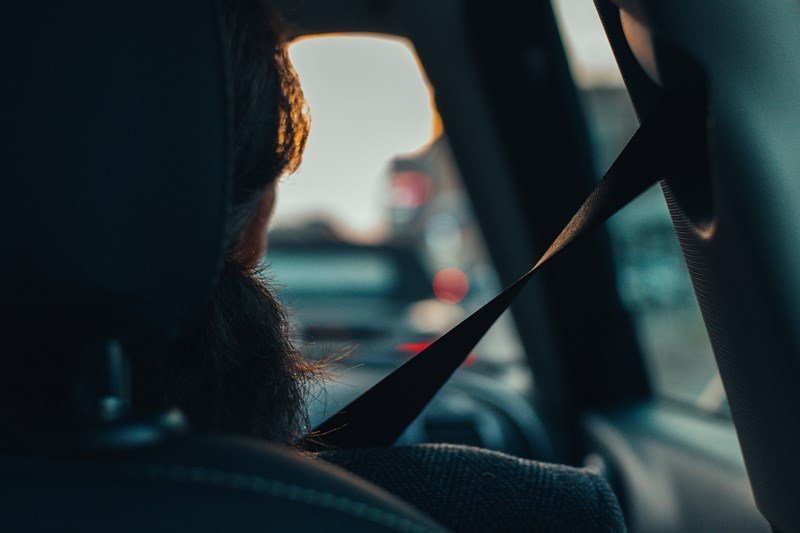 seatbelted driver in traffic