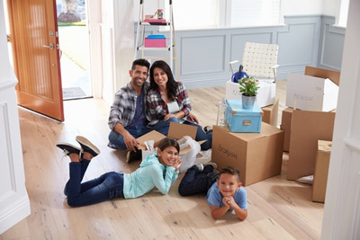 family unpacking after moving in